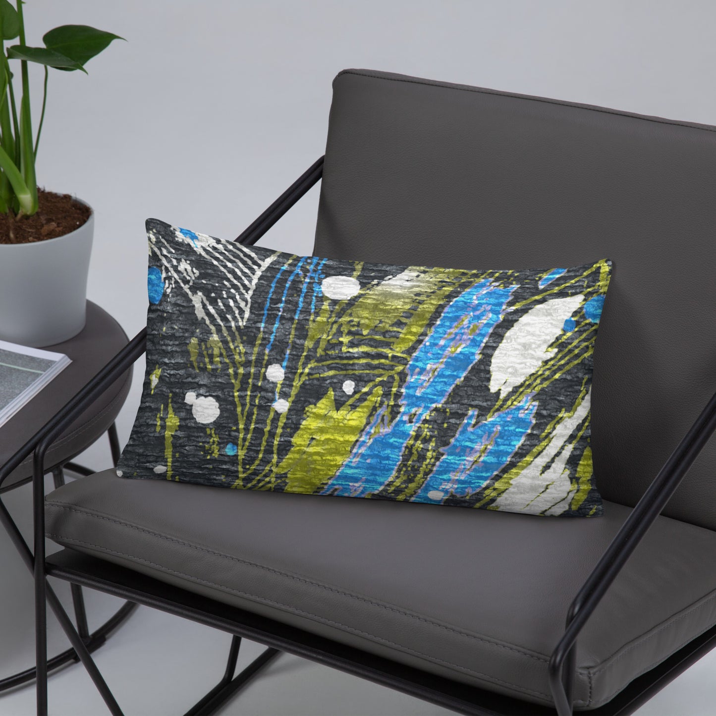 A colorful geometric patterned premium pillow case. For gray and blue sofa for modern interior
