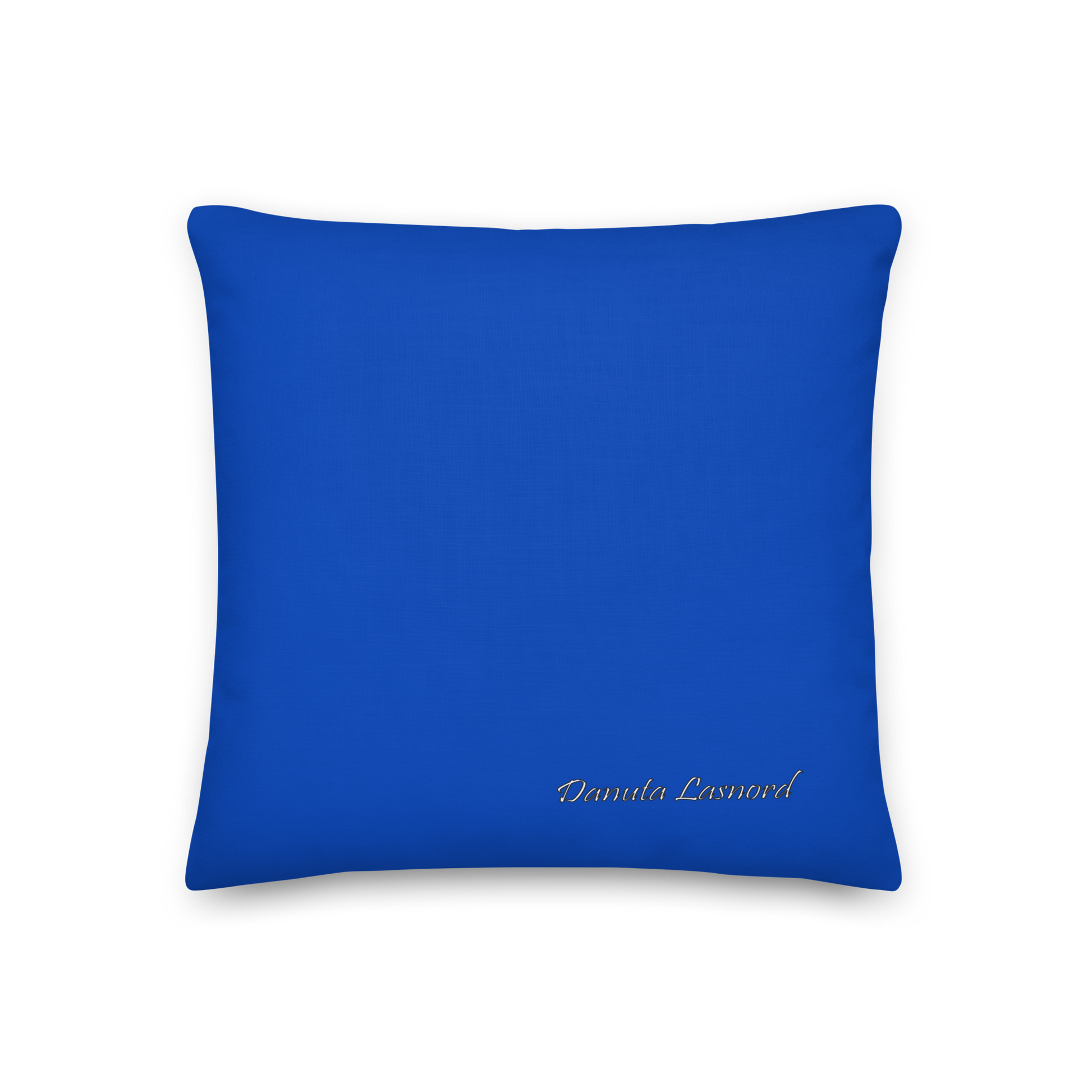 Blue pillow with 'Danuta Lasnord' branding on a blue background